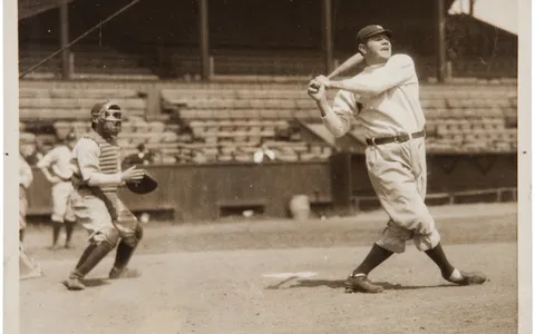 Babe Ruth in a Yankees uniform at full swing during batting practice, about 1921