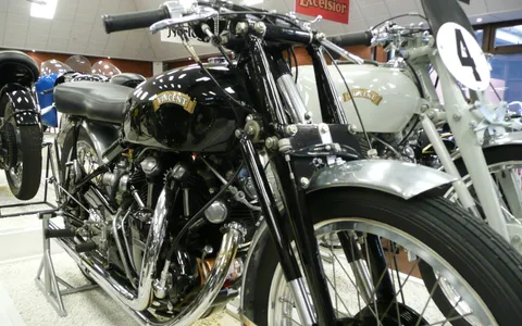 A Vincent Series C Black Lightning racing motorcycle on display in a museum