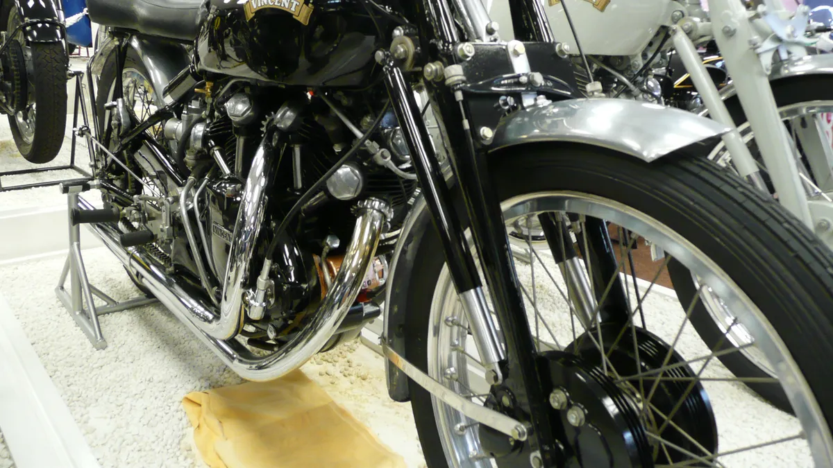 A Vincent Series C Black Lightning racing motorcycle on display in a museum